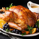 Festive celebration roasted turkey with gravy for Thanksgiving or Christmas
