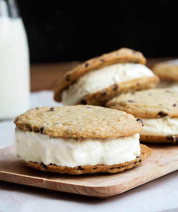 A thin, crispy gluten free chocolate chip cookie with vanilla ice cream sandwiched between. 
