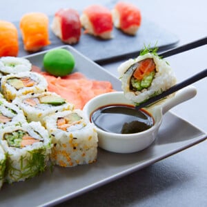 Sushi Maki and Niguiri with soy sauce and wasabi with California Roll