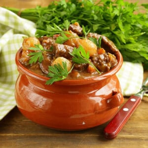 21728662   beef stew with vegetables and herbs in a clay pot   comfort food