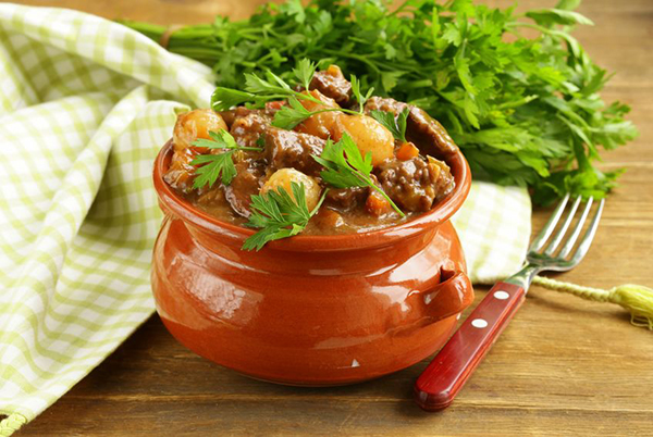 21728662   beef stew with vegetables and herbs in a clay pot   comfort food