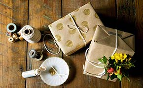DIY gift wrap made with brown paper and gold paint