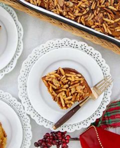 Greek Honey Almond Cake on white plates with decorative edges.