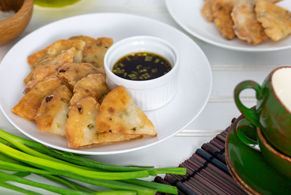 Scallion Pancakes with dipping sauce on a white plate