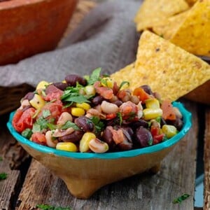 Black Bean Salsa in a colorful bowl with corn tortilla chips