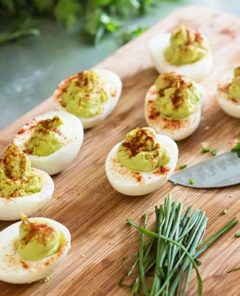 Avocado Cream Eggs on a cutting board