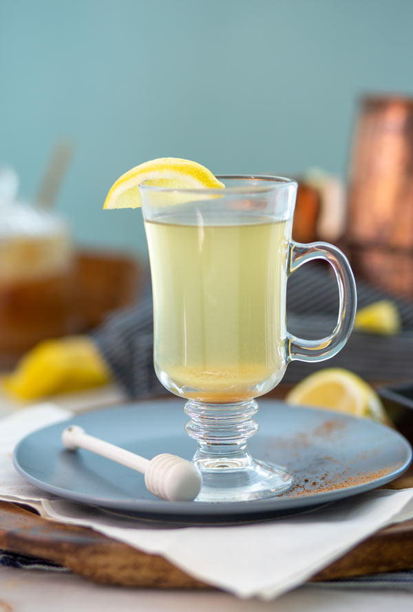 Daily Detox Drink in a glass with a lemon wedge on the rim