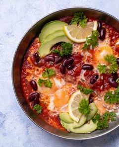 Eggs with Black Beans and Avocado in a pan