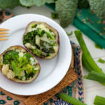 Go Green Stuffed Potatoes Recipe on a plate with a colorful floral napkin underneath