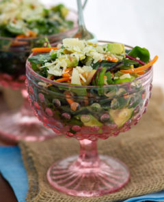Kale & Apple Salad in a pink glass dish