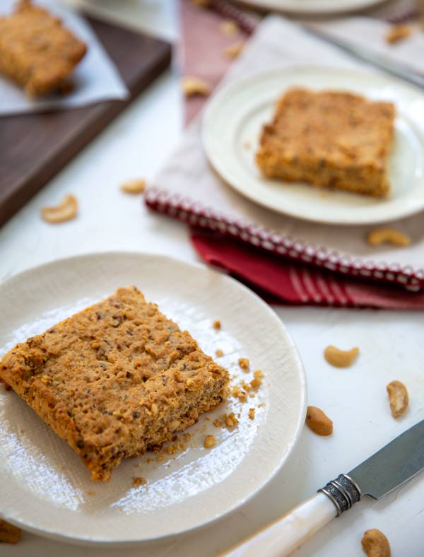 Oaty Breakfast Bars on a white plate with red and white napkins underneath