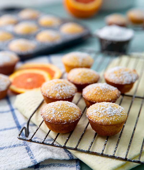 Almond Orange Mini Cakes on a wire cooling rack