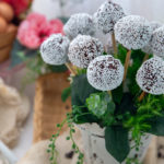 Easy Gluten-Free Cake Pops in a vase with fake leaves in between