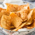 Fried Wontons in a basket with parchment paper