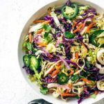 Jalapeno Coleslaw with purple cabbage in a white serving bowl