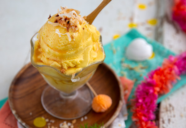 Mango Coconut Ice Cream with shredded toasted coconut on top