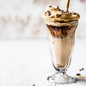 Peanut Butter Banana Dalgona Smoothie in a tall glass