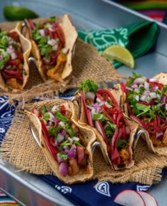 Vegan Barbacoa Tacos lined up on a plate