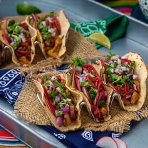 Vegan Barbacoa Tacos lined up on a plate
