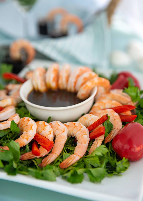 Shrimp Cocktail with Tamari Honey Dipping Sauce Recipe on a bed of greens