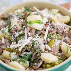 Gnocchi, Asparagus & Sausage Skillet with White Wine closeup in a bowl