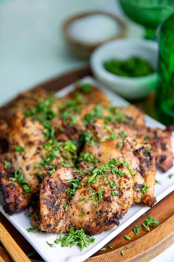 Closeup of Grilled ACV Chicken Thighs Recipe on a white square plate