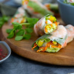 Closeup of Fresh Spring Rolls on a wooden serving tray