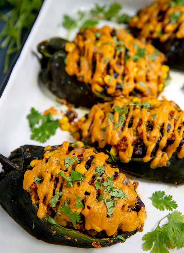 Closeup of Stuffed Poblano Peppers on a white platter