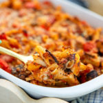 Closeup of Gluten-Free Baked Penne with Roasted Vegetables in a white serving dish