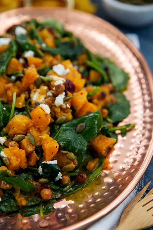 Butternut Squash and Kale Fall Salad on a bronze oval serving platter