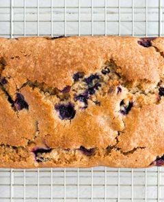 Overhead view of Blueberry Muffin Bread loaf on a wire rack