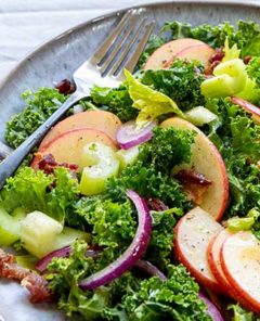 Kale Apple Salad on a gray plate with a silver fork