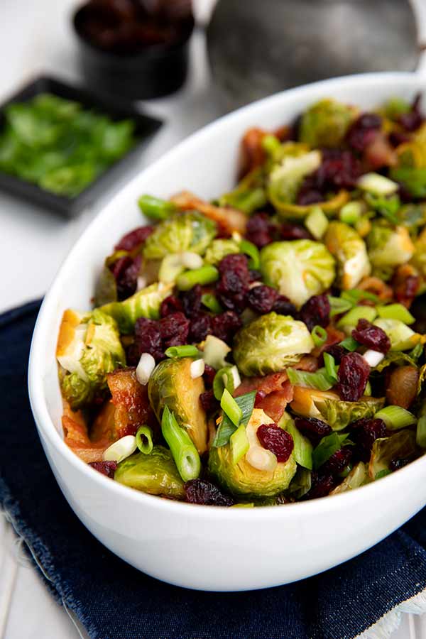 Soy-Glazed Brussels Sprouts in a white oval serving dish