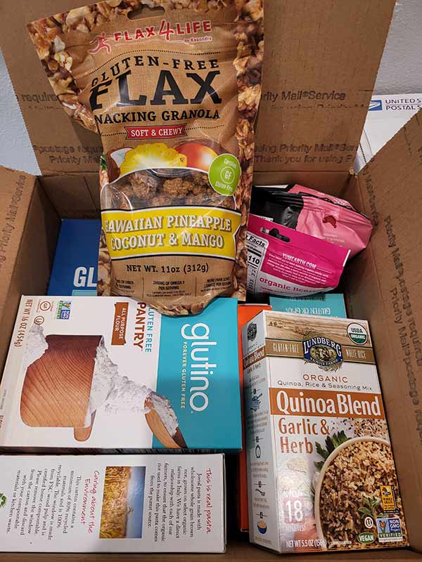 Inside of a GIG Cares package with gluten-free products in it