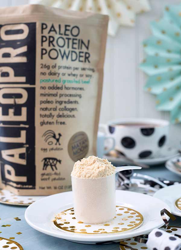 Paleo Pro Protein Powder Scoop on a plate with party decorations in the background