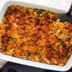 Overhead view of Plant-Based Breakfast Casserole in a white rectangular casserole dish on a light whitewash wood table