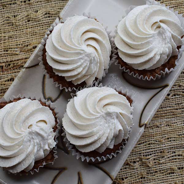 Superfree Bakehouse Cupcakes overhead view on a white rectangular tray