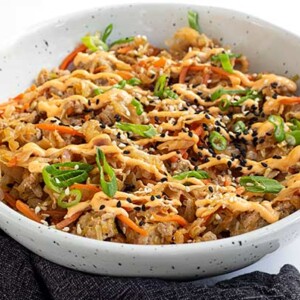 Egg Roll in a bowl in a white bowl with a black napkin below it