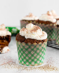a front view of a irish coffee cupcake in a green checkered cupcake holder