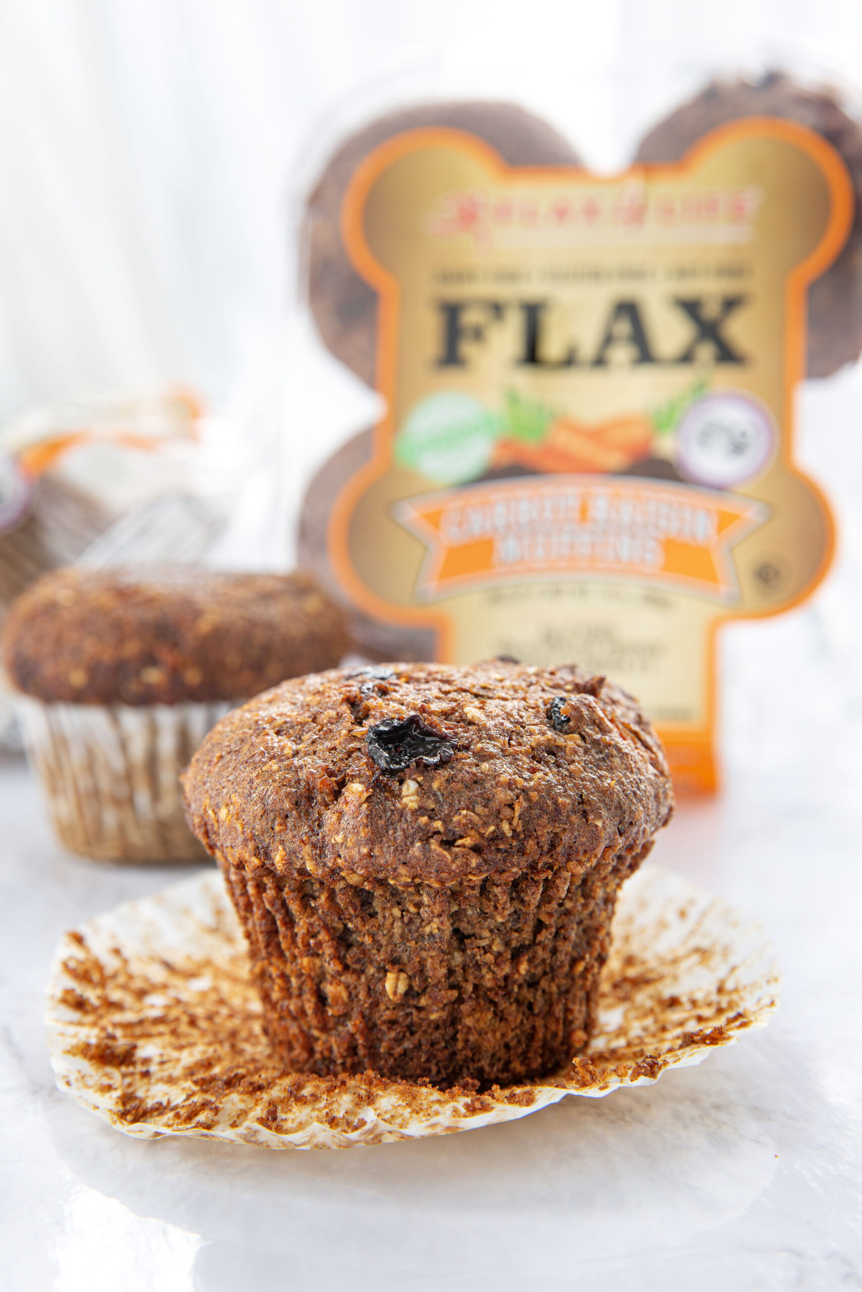 Flax4life muffins with the wraper in the bakc. 