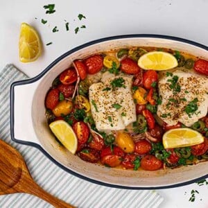Cod-with-Roasted-Heirloom-Tomatoes,-Capers,-and-Olives-in-Pan-Feature